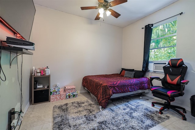 bedroom featuring cooling unit and ceiling fan