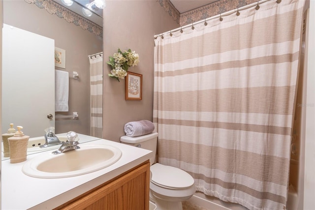 bathroom featuring a shower with curtain, vanity, and toilet