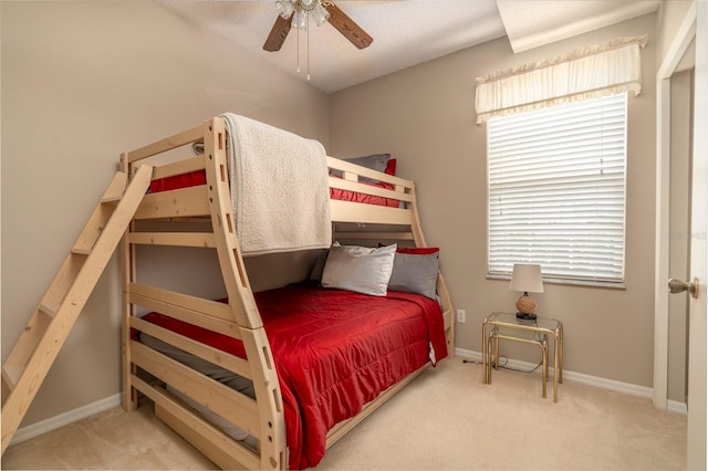 carpeted bedroom featuring ceiling fan