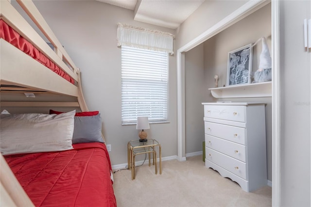 carpeted bedroom featuring multiple windows