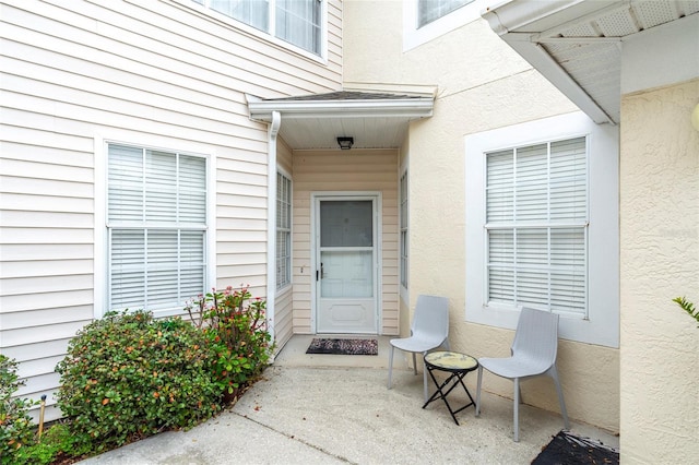 doorway to property with a patio