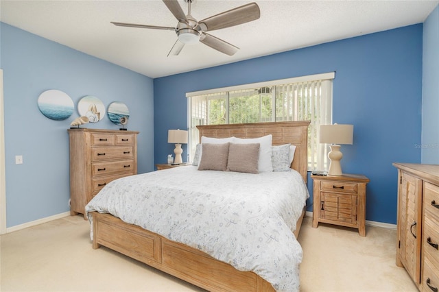 bedroom with light carpet and ceiling fan