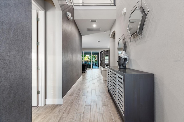 hall with light wood-type flooring