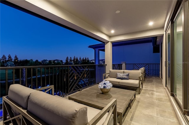 balcony at dusk with outdoor lounge area