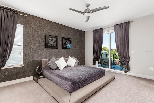 bedroom with ceiling fan, access to exterior, and carpet floors