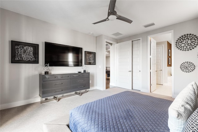 carpeted bedroom with connected bathroom and ceiling fan