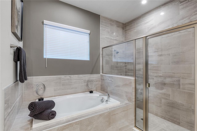 bathroom with separate shower and tub