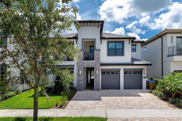 view of front of property with a garage