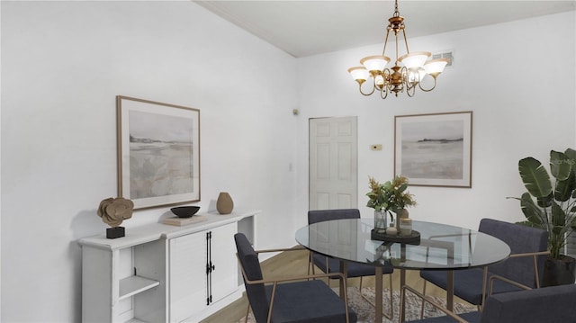 dining area featuring a chandelier