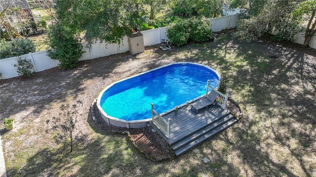 view of swimming pool with a wooden deck