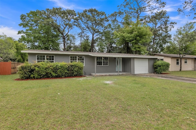 single story home featuring a garage and a front yard