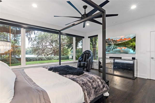 bedroom with dark hardwood / wood-style floors and ceiling fan