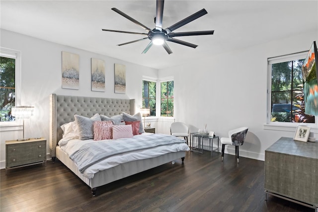 bedroom with dark wood-type flooring and ceiling fan