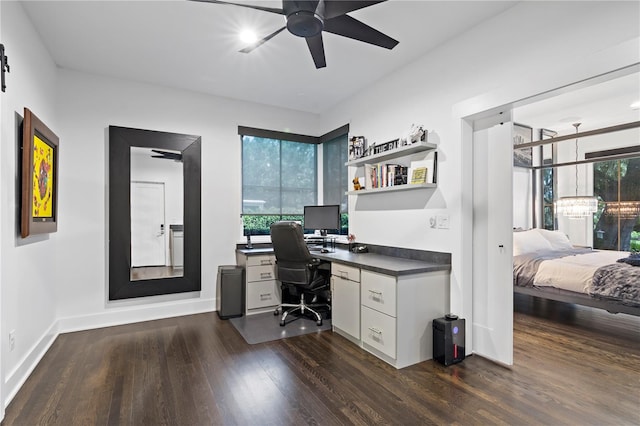 home office with dark hardwood / wood-style flooring, plenty of natural light, and ceiling fan