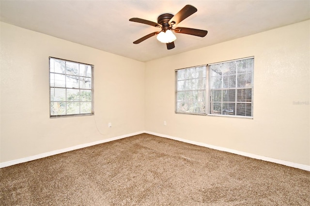 carpeted empty room with ceiling fan