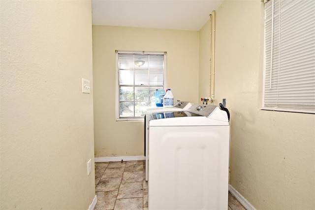 laundry area with independent washer and dryer