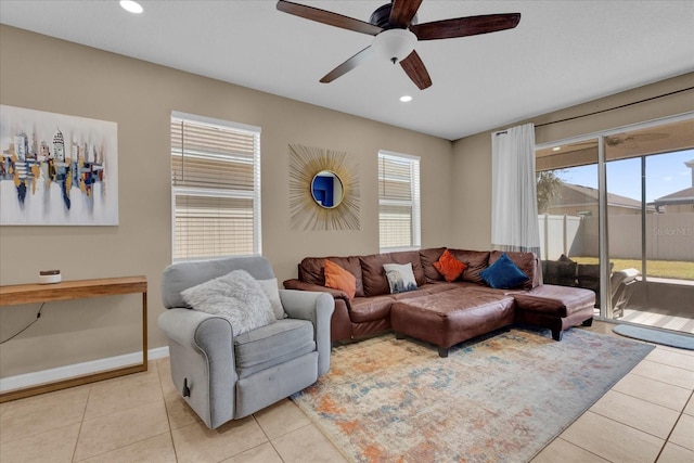 tiled living room with ceiling fan