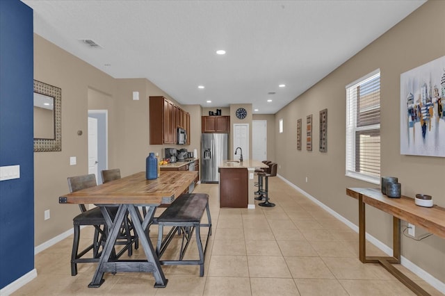 tiled dining room with sink