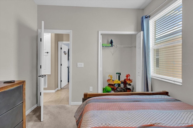 carpeted bedroom featuring a closet