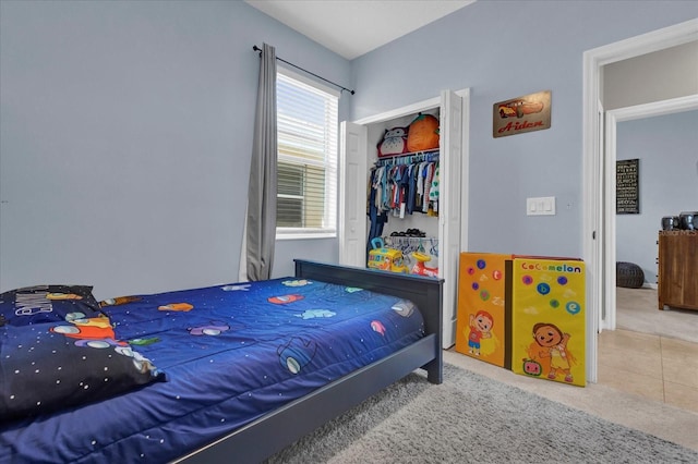 carpeted bedroom featuring a closet