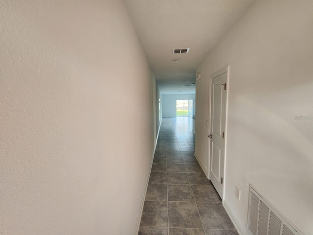 corridor with visible vents and baseboards