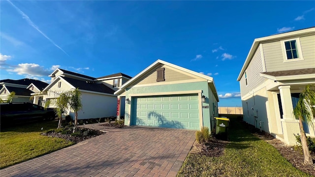 view of front of property featuring a garage and a front yard