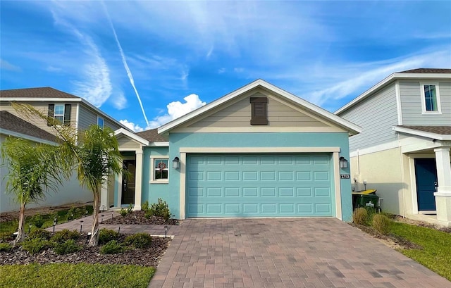 2713 Runners Cir, Clermont, FL 34714 - ranch-style house featuring an attached garage, decorative driveway, and stucco siding