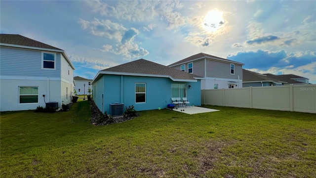 2713 Runners Cir, Clermont, FL 34714 - back of house with cooling unit, fence, a patio, and a lawn