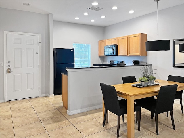 kitchen with light tile patterned floors and black appliances