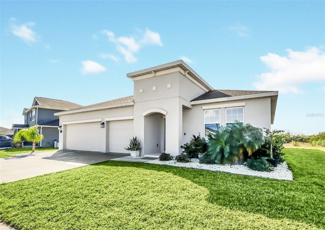 view of front of home with a garage and a front yard