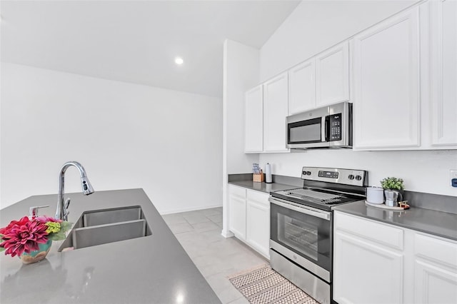 kitchen featuring white cabinetry and appliances with stainless steel finishes