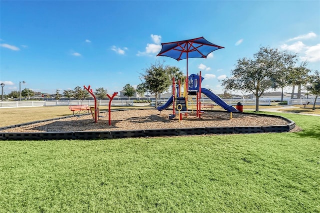 view of playground with a yard