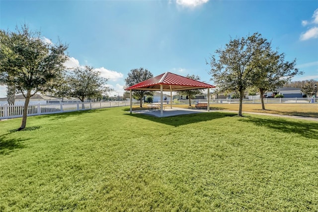 surrounding community with a yard and a gazebo