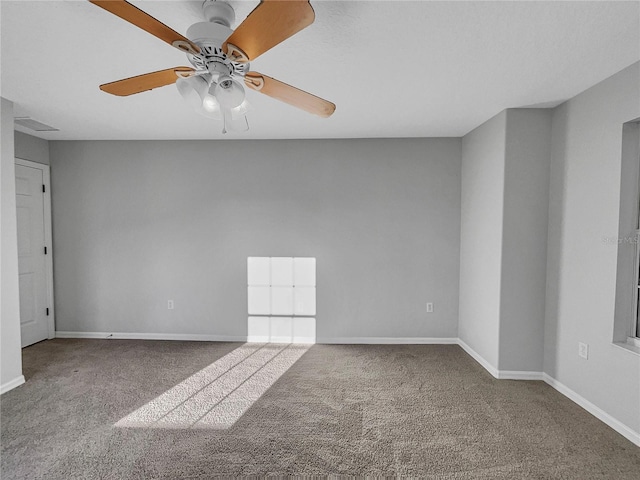 carpeted spare room with ceiling fan