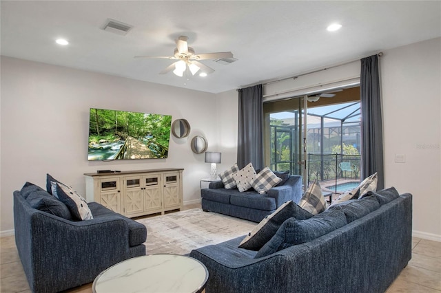 tiled living room with ceiling fan