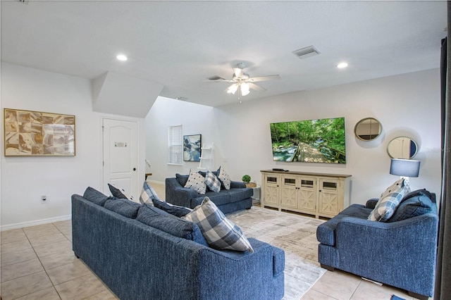 tiled living room with ceiling fan