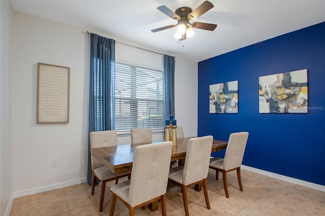 tiled dining room with ceiling fan