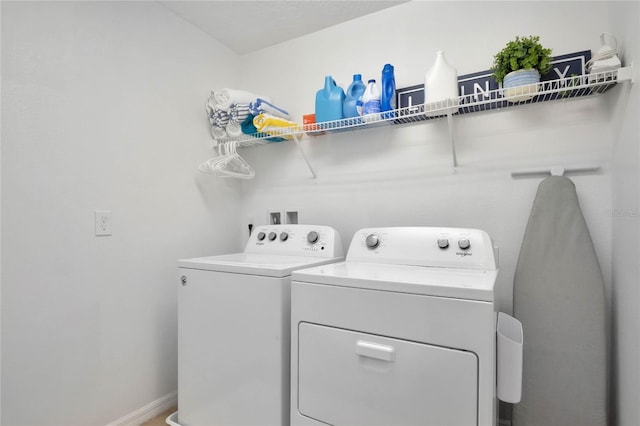 laundry area with independent washer and dryer