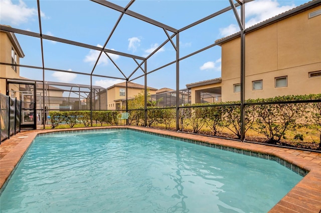 view of pool featuring a lanai