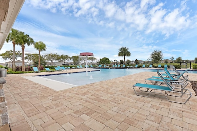 view of pool with pool water feature and a patio area