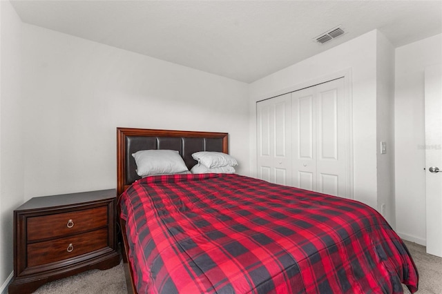 bedroom featuring a closet and carpet