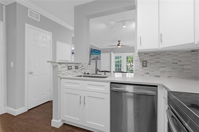 kitchen with white cabinetry, dishwasher, sink, and kitchen peninsula