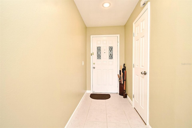 entryway with light tile patterned flooring