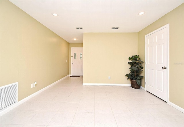 spare room featuring light tile patterned floors