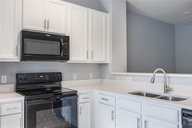 kitchen with white cabinetry, sink, a textured ceiling, and black appliances