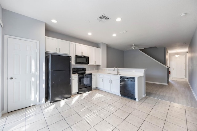 kitchen with light tile patterned flooring, sink, white cabinetry, ceiling fan, and black appliances