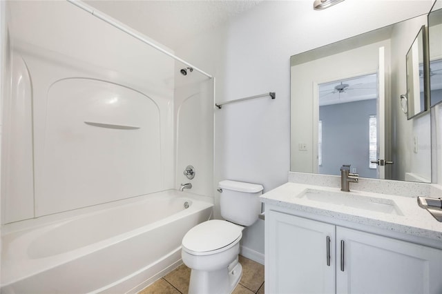 full bathroom featuring ceiling fan, vanity, bathtub / shower combination, tile patterned floors, and toilet