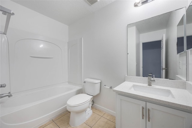 full bathroom featuring tile patterned flooring, vanity, a textured ceiling, and toilet