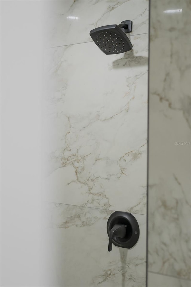 details featuring tiled shower