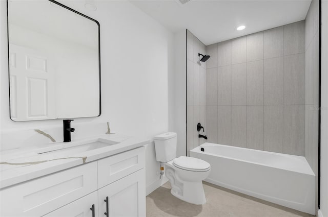 full bathroom with vanity, toilet, and tiled shower / bath combo